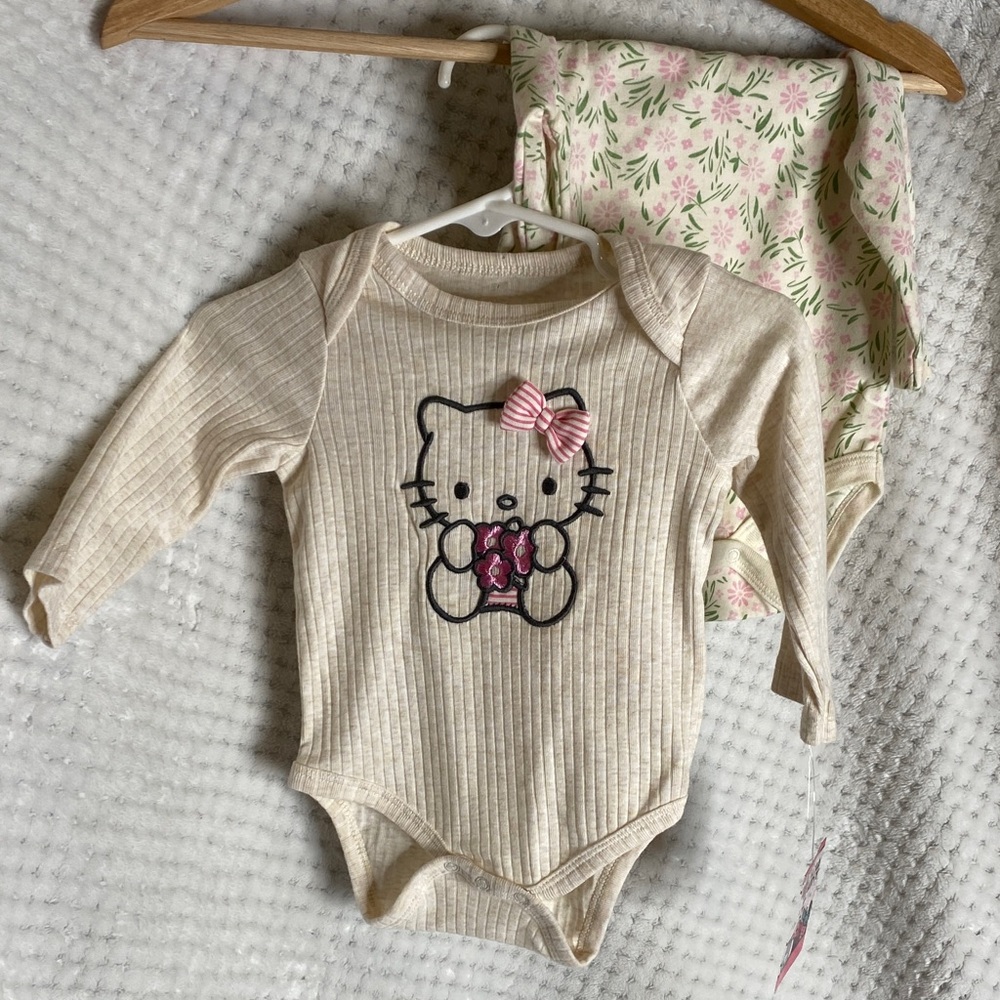 Hello Kitty Cream Long Sleeve Bodysuit with Pink Bow